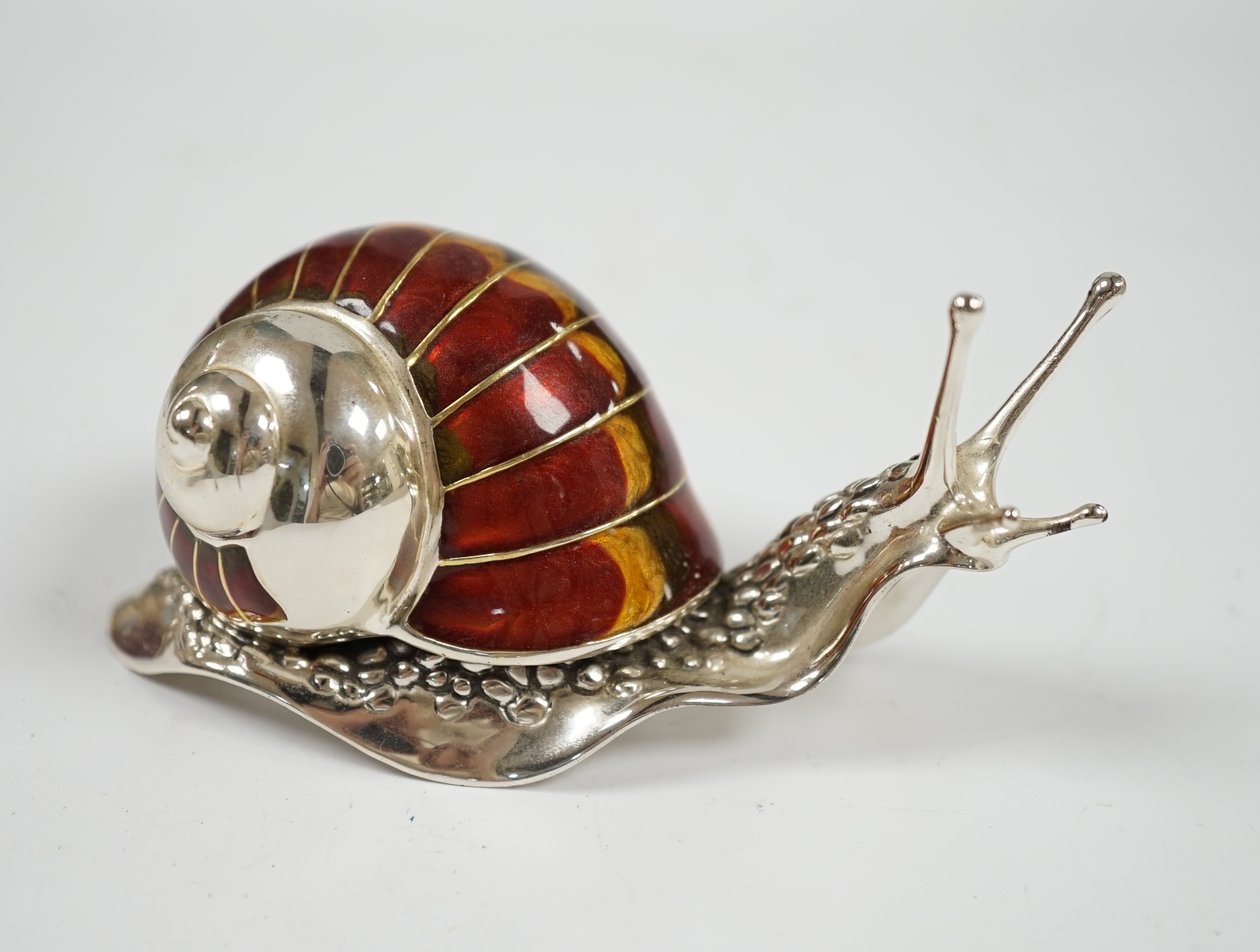 A Saturno silver and enamel model of a snail, by Francis Howard, length 10cm, gross weight 5oz. Condition - good